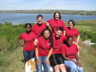 Campus Ministry team. Moreen is front row, far right; Sarah is back row, far right. Source: John Meehen, SJ