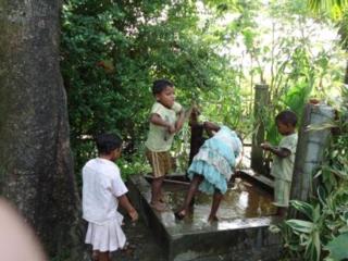 Students of St. Xavier's SChool at the pump, Sadakbari, Jhapa