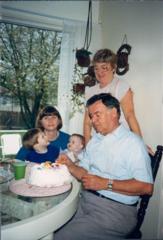 Douglas Shano puts the finishing touches on an Easter rabbit cake while Philip Shano's mother, Frances and sister Elaine and two of her children look on. Source: Philip Shano, SJ
