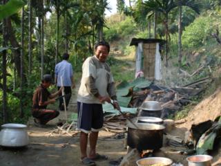 Boniface Rai cooking a meal after the blessing of the new chapel and priest's residence in his village, Patapur. Source: Fr. David Ekka