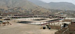 There are no paved roads in Jicamarca, but there is a beautiful school. 