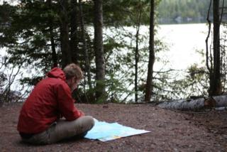 The author, reading a map.