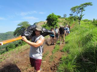 Carrying the cross up the mountain to La Loma.
